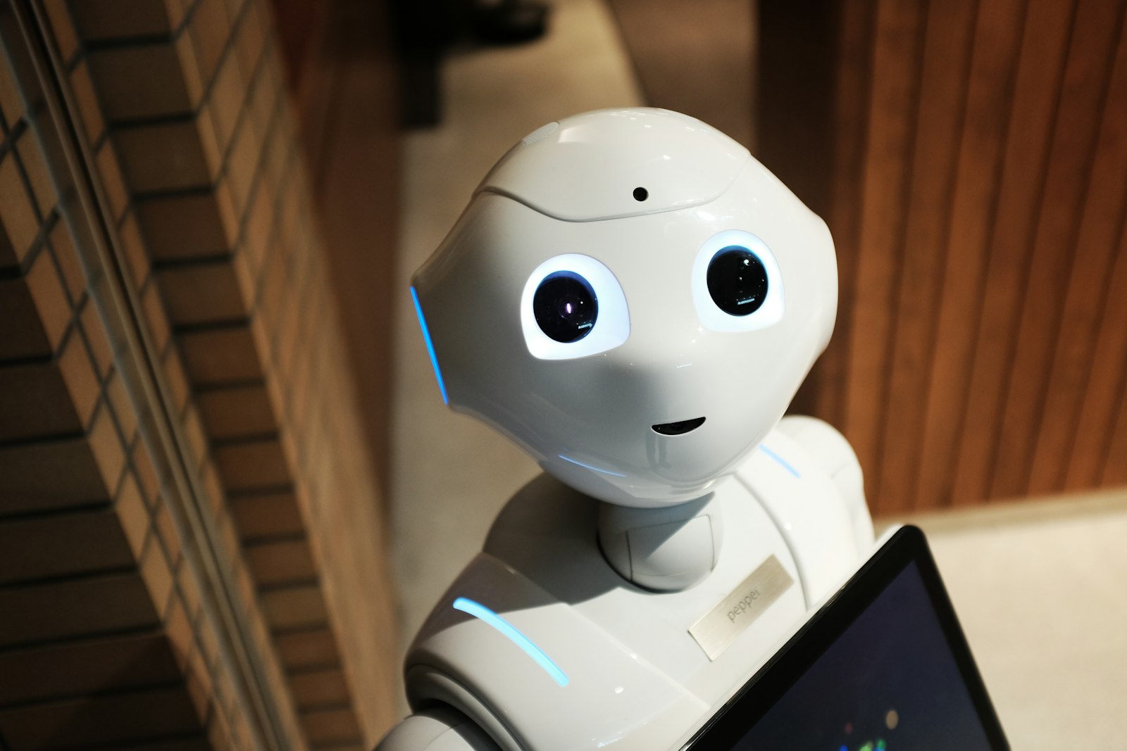 Friendly robot representing an efficient AI smart worker ready to take on business tasks